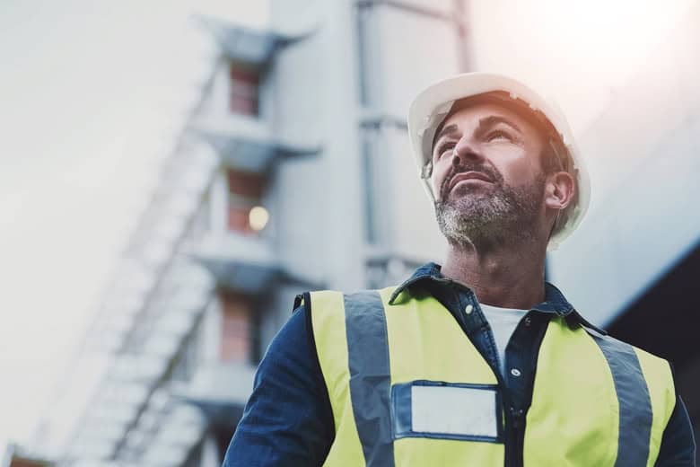 man-wearing-hard-hat-construction-vest-light-duty-work